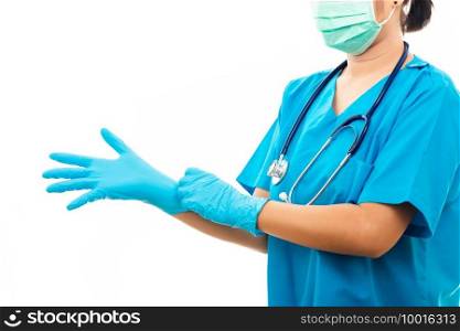 Female nurse standing with stethoscope puts on rubber gloves and wearing medical face mask, woman doctor in blue uniform, studio shot isolated on over white background, medical health concept