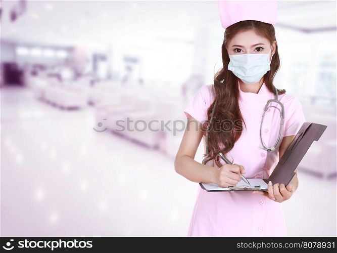 female nurse writing medical report in hospital background