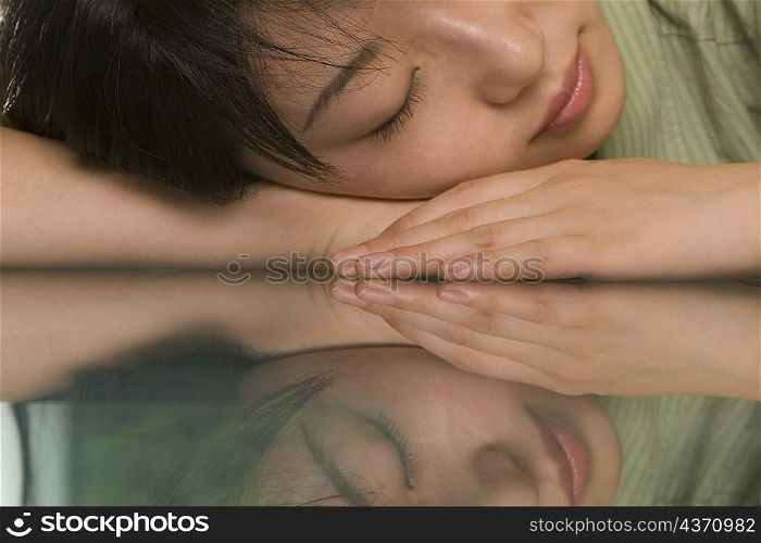 Female office worker napping at a table