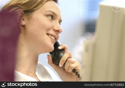 female office worker on phone
