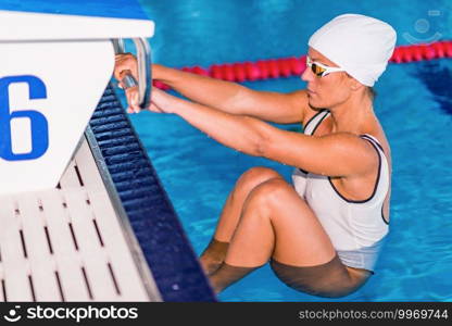 Female on Start position on  pool side