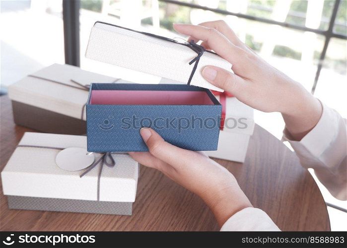 female opening a gift box, Valentine’s day surprise concept
