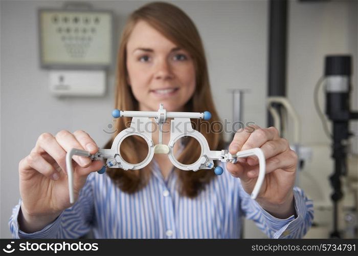 Female Optician Giving Patient Sight Test