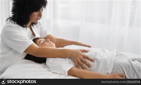 female osteopathist treating child 2