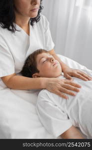 female osteopathist treating child