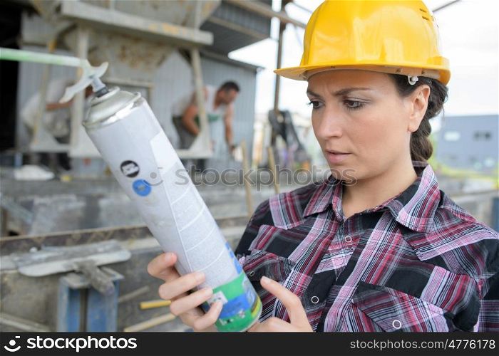 female painter with a spray can