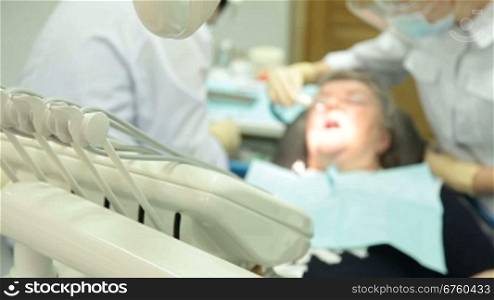 Female patient at the dentist surgery