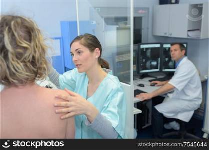 female patient at xray machine with female doctor