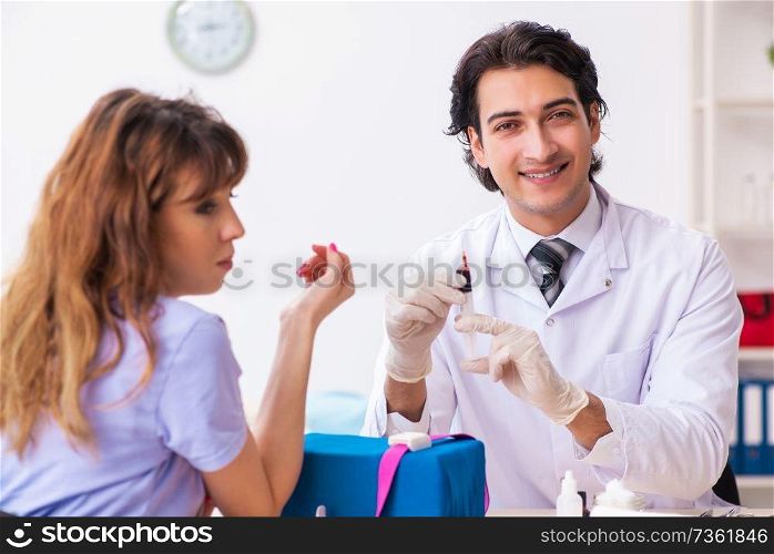 Female patient during blood test sampling procedure 