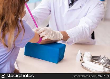 Female patient during blood test sampling procedure