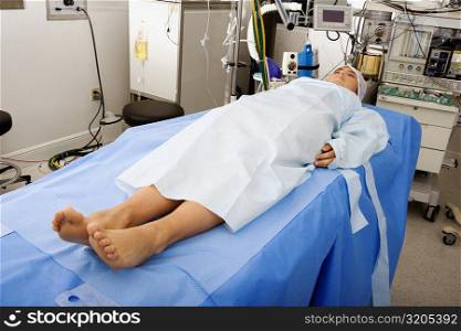 Female patient lying on an operating table