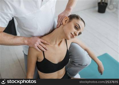 female patient physiotherapy doing exercises with physiotherapist