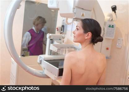 female patient undergoing mammography test in hospital