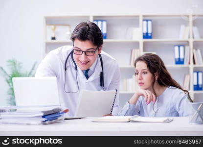 Female patient visiting male doctor for regular check-up in hospital clinic. Female patient visiting male doctor for regular check-up in hosp