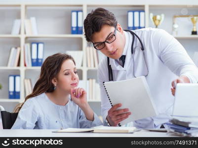 Female patient visiting male doctor for regular check-up in hospital clinic. Female patient visiting male doctor for regular check-up in hosp