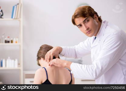 Female patient visiting young handsome doctor chiropractor 