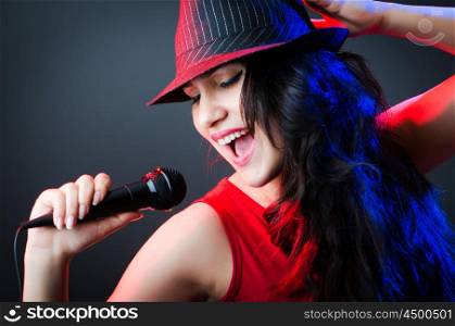 Female performer at disco with mic