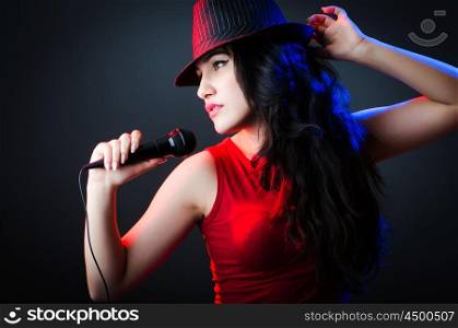 Female performer at disco with mic