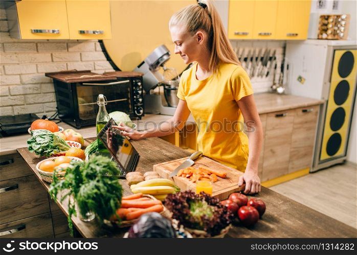 Female person cooking on the kitchen, healthy food. Vegetarian diet, fresh vegetables and fruits. Female person cooking on the kitchen, healthy food