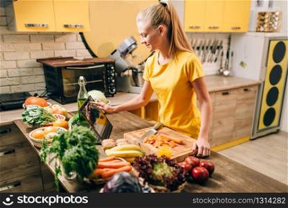 Female person cooking on the kitchen, healthy food. Vegetarian diet, fresh vegetables and fruits. Female person cooking on the kitchen, healthy food