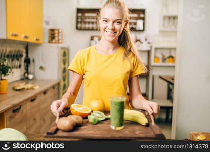 Female person holding a tray with cocktail, fruits and vegetables, cooking organic food. Vegetarian diet, healthy lifestyle concept. Female person with cocktail, fruits and vegetables