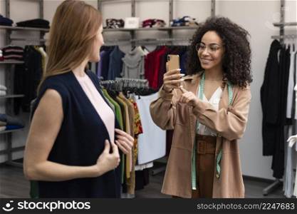 female personal shopper taking s cutomer 3. female personal shopper taking s cutomer 2