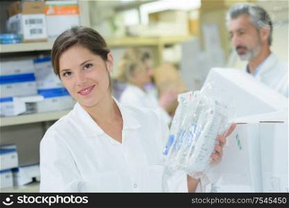 female pharmacist smiling at the camera