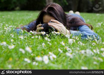 female photographer on the grass