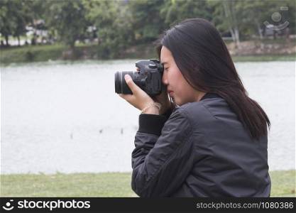 Female photographer takes photo
