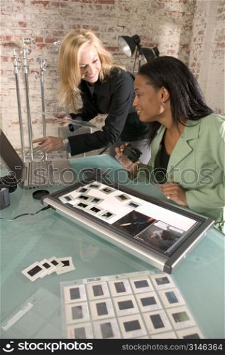 Female Photographers Working Together In A Studio