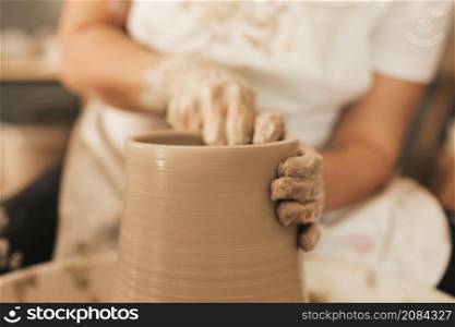 female potter working pottery wheel