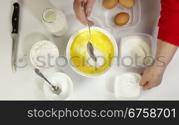 Female preparing pancake batter in the kitchen