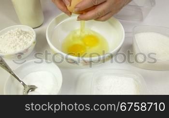 Female preparing pancake batter in the kitchen