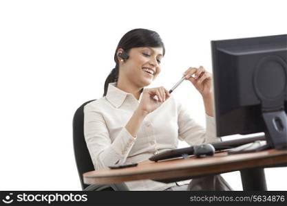 Female professional on call with desktop