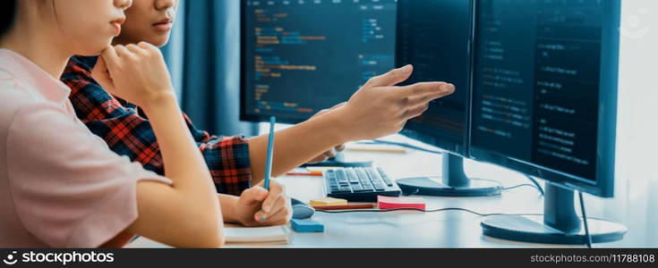Female programer explain while pointing code displayed on computer. Professional programmer present data analysis and writing java script at modern company office. Closeup. Burgeoning.. Female programer explain while pointing code displayed on computer. Burgeoning.