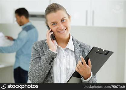 female property agent using smartphone