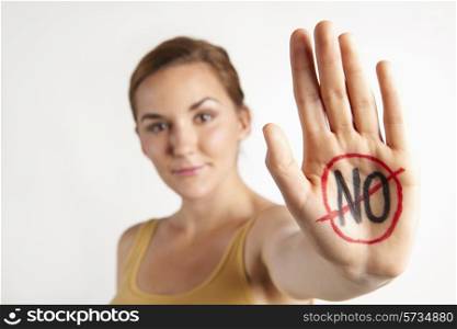 "Female Protestor With "No" Written On Palm"