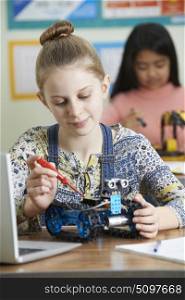 Female Pupils In Science Lesson Studying Robotics