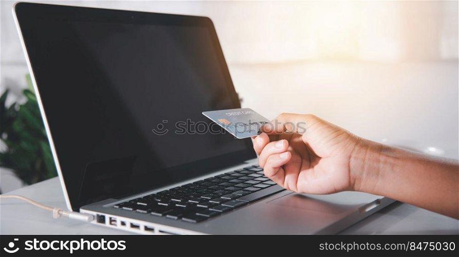 Female register via credit cards on computer make electronic payment security online, Woman hands holding credit card and using laptop with product purchase at home, Internet online shopping concept