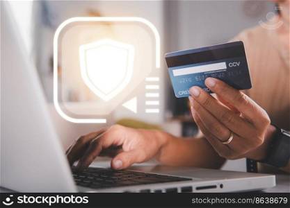 Female register via credit cards on computer make electronic payment security online, Woman hands holding credit card and using laptop with product purchase at home, Internet online shopping concept