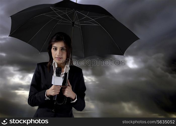 Female reporter standing in rain