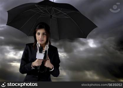 Female reporter standing in rain