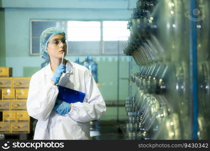 Female researcher carrying out scientific research in drinking water factory