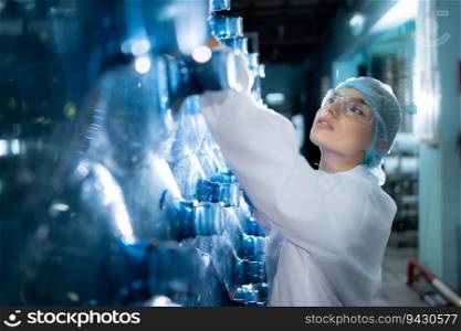 Female researcher carrying out scientific research in drinking water factory