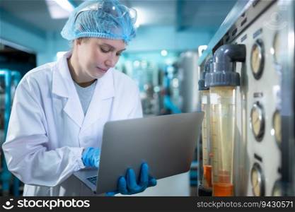 Female researcher doing scientific research on drinking water in the laboratory of a drinking water plant.