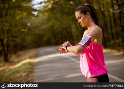 Female runner during outdoor workout in beautiful  autumn mountain nature landscape