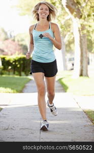 Female Runner Exercising On Suburban Street