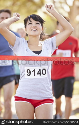 Female Runner Winning Marathon