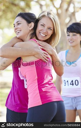 Female Runners Congratulating One Another After Race