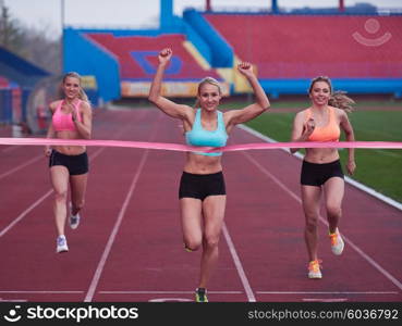 Female Runners Finishing athletic Race Together